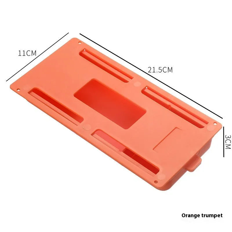Small white plastic storage box with a grid pattern, shown adhered underneath a wooden table.