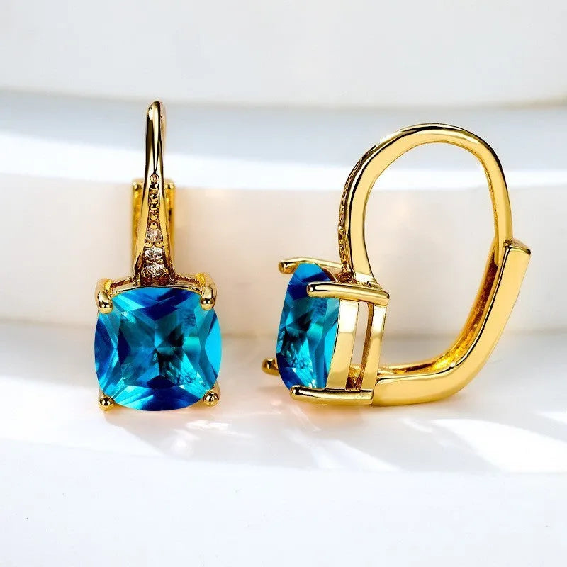 Square geometric ear hook studs with a round zircon stone, shown in a gold electroplated finish.