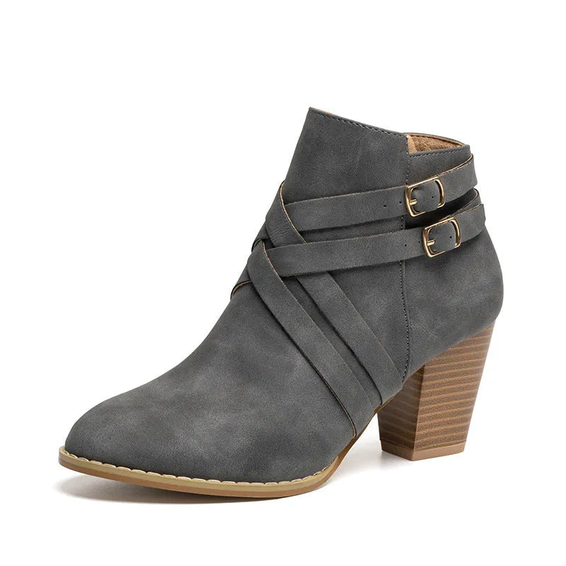 Men's black short ankle boots with side zip, belt buckle, and a 7cm heel.
