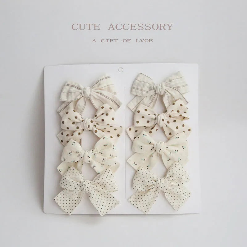 Children's cloth hairclips with dovetail bow decoration in multiple colour options