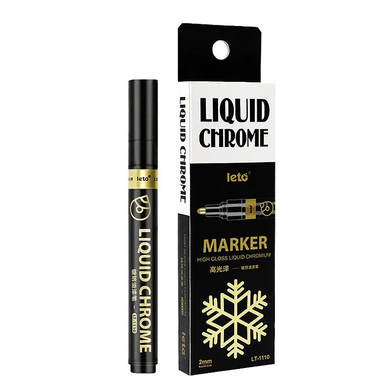 Metal mirror chrome plated marker pen with reflective metallic tip on a smooth surface