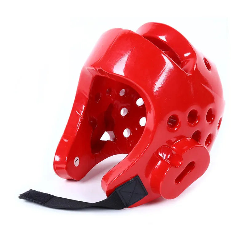 Karate protective gear set showing red leg guards, helmet and boxing gloves for martial arts training