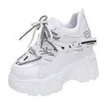 Women's white breathable mesh platform sports shoes with cross strap and rubber sole.