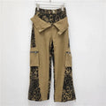 Women's dark khaki leopard print high-waist jeans with tooling style stitching and straight leg