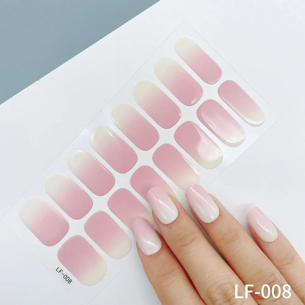 Set of 16 solid colour full nail art stickers showing patterns like cross, rose, tulip, and cartoon designs.
