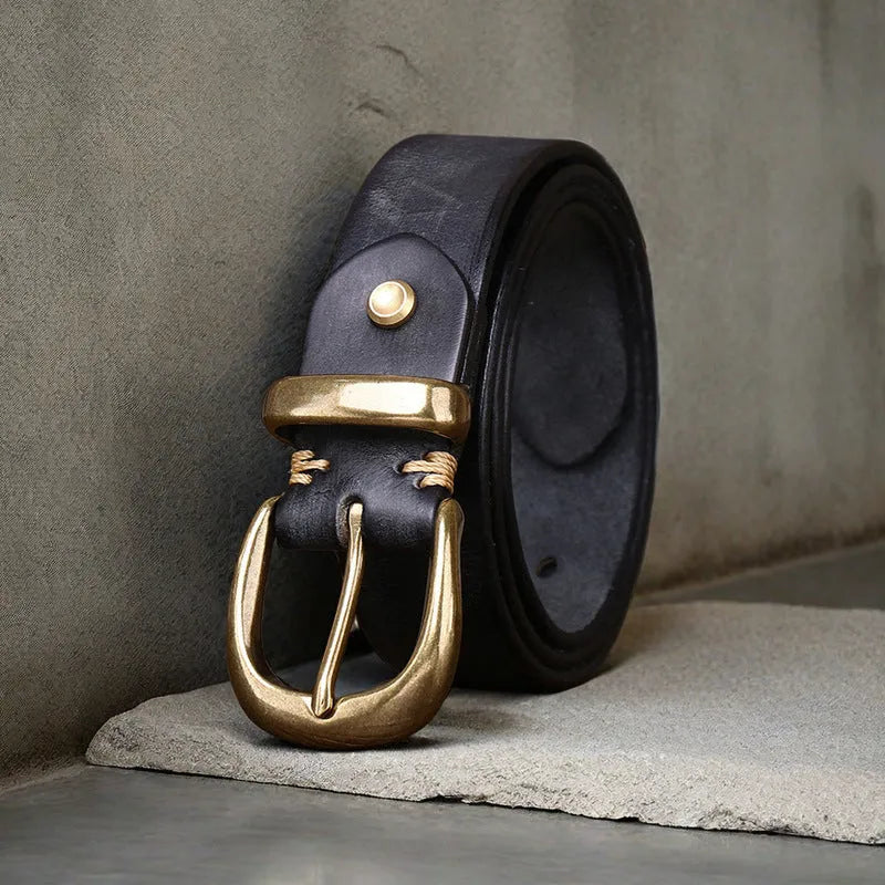 Men's black genuine cowhide casual belt with copper pin buckle on a jeans background