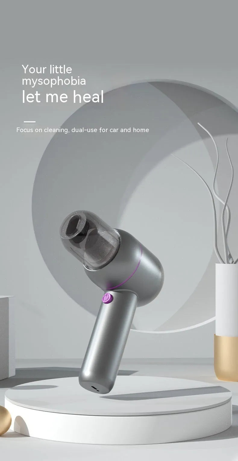 Grey XC-06 handheld portable car vacuum cleaner with brush nozzle and extended nozzle.