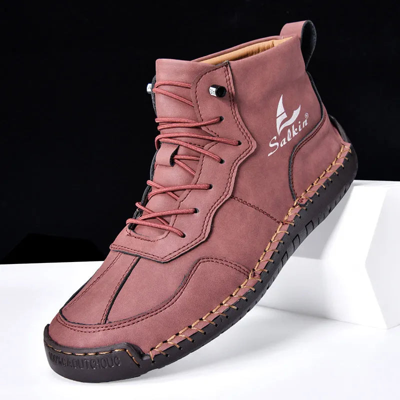 Casual high-top leather boots with elastic band closure and flat heel in beige colour with visible sewing detailing