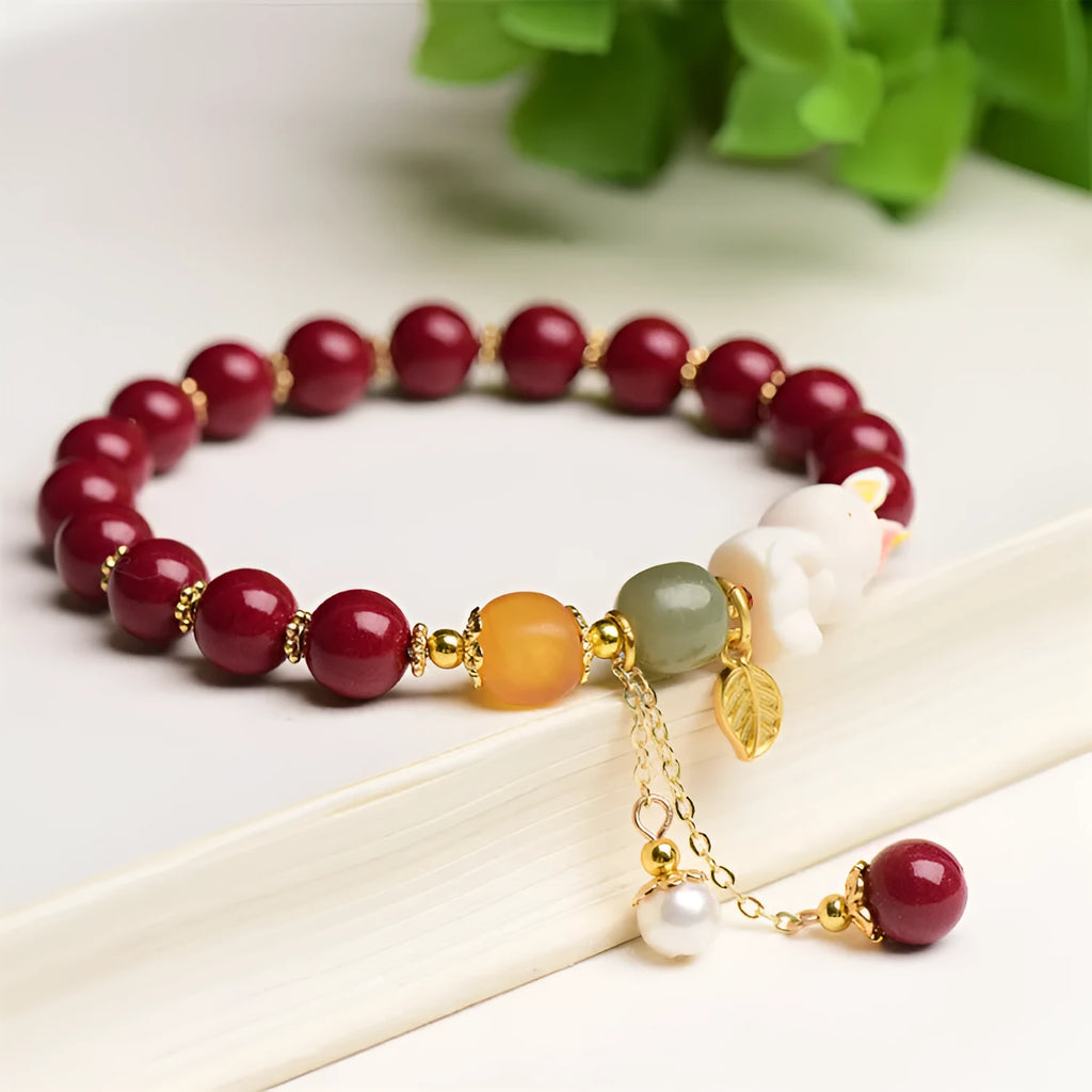 Natural red cinnabar bracelet for women featuring a carved rabbit design, shown in 8mm and 10mm width options.