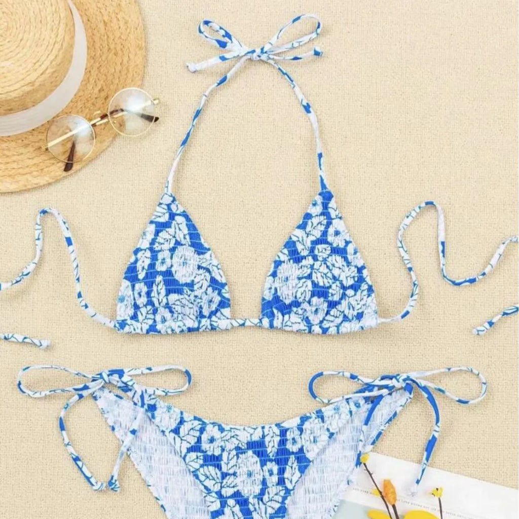 Women's floral patterned halter-neck bikini set in multiple colours on a mannequin