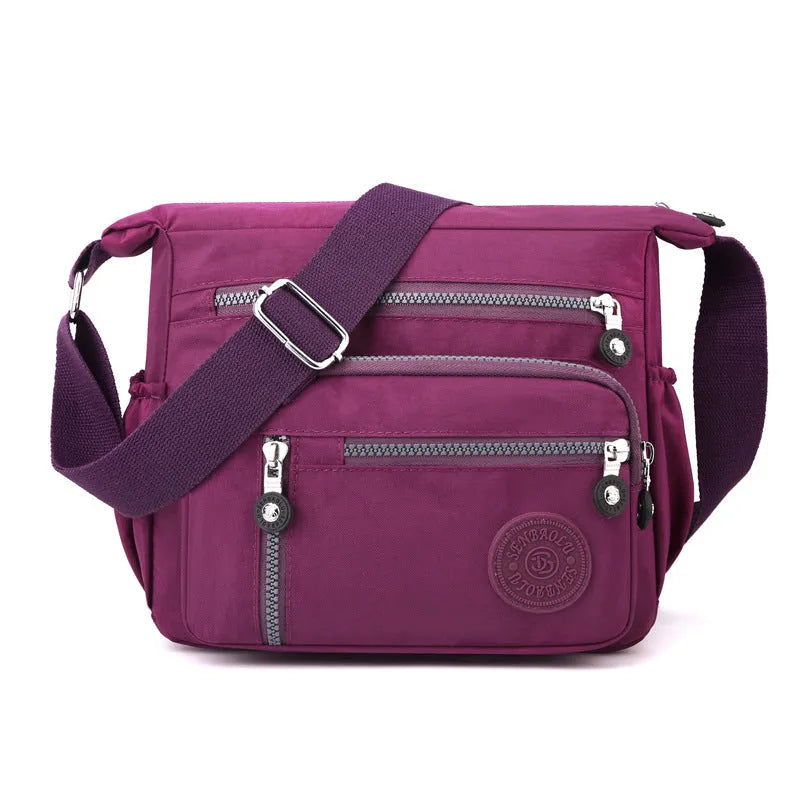 Soft nylon large capacity square messenger bag in multiple colour options on a single shoulder strap.