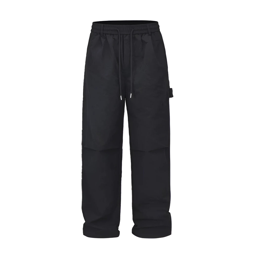 Black paratrooper trousers with elastic waistband and three-dimensional cutting in baggy fit style