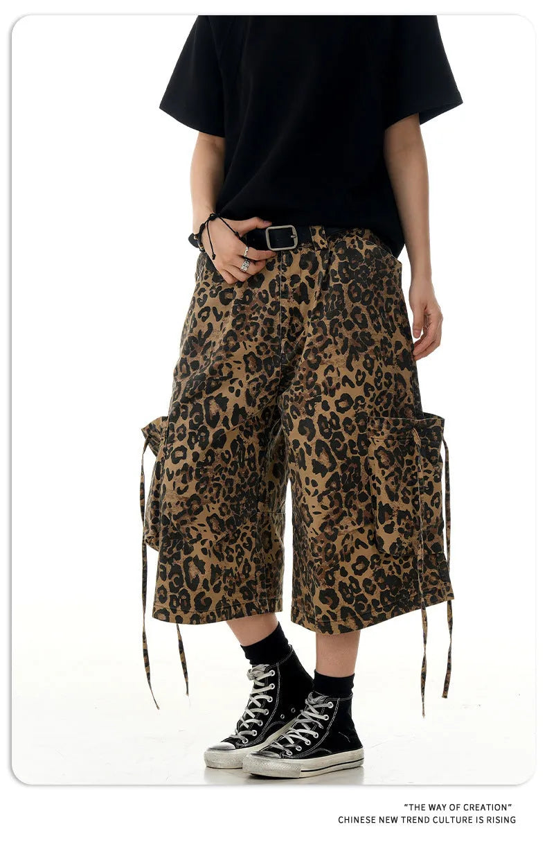 Women's loose straight cropped pants in a leopard print pattern with a high waist and button fly.