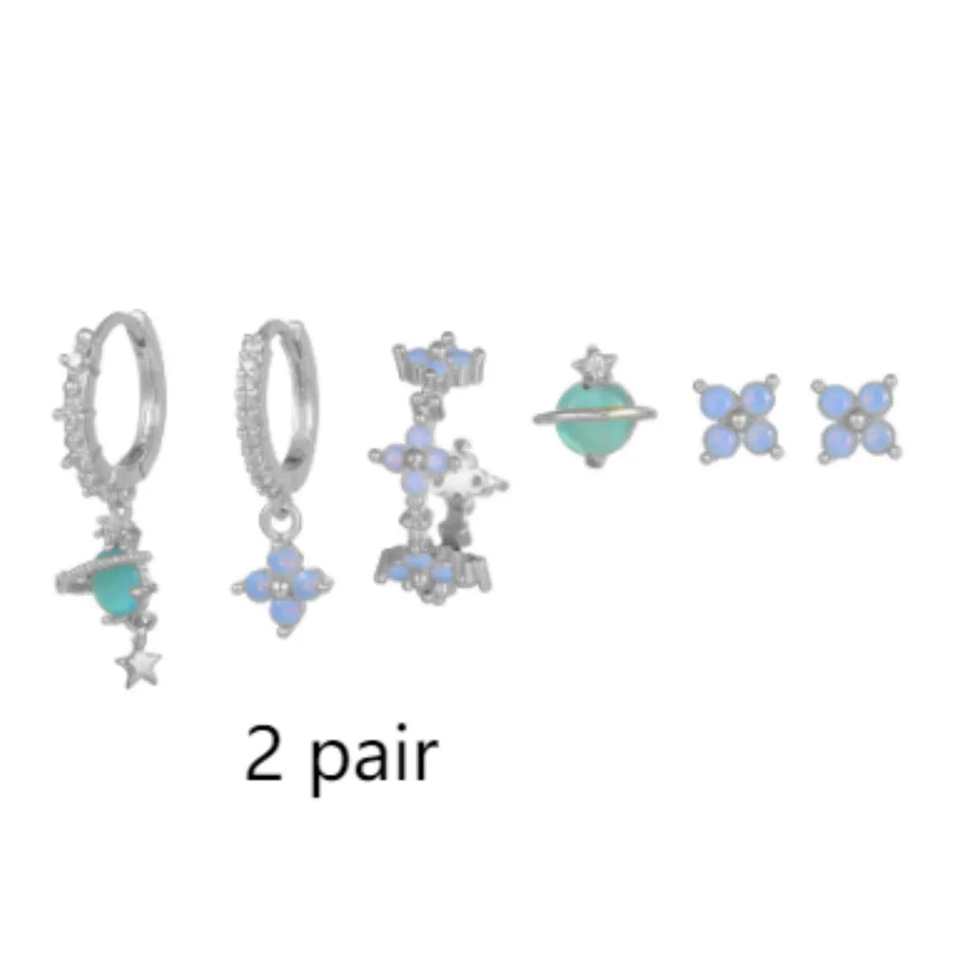 Flower-shaped stud earrings with zircon crystal centres in gold and silver colour options