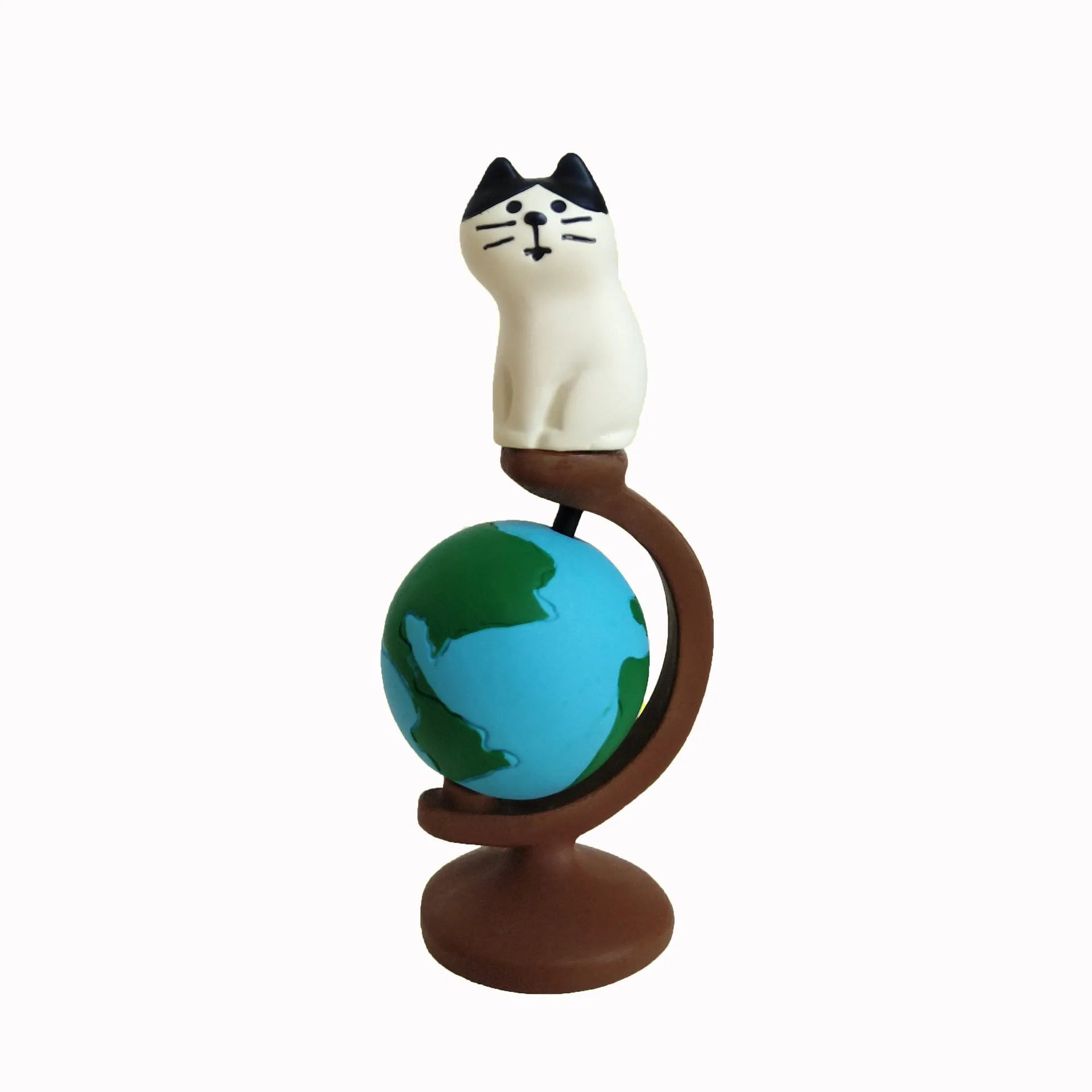 Cartoon resin craft sculpture of a cat dressed as the Statue of Liberty, holding a globe.
