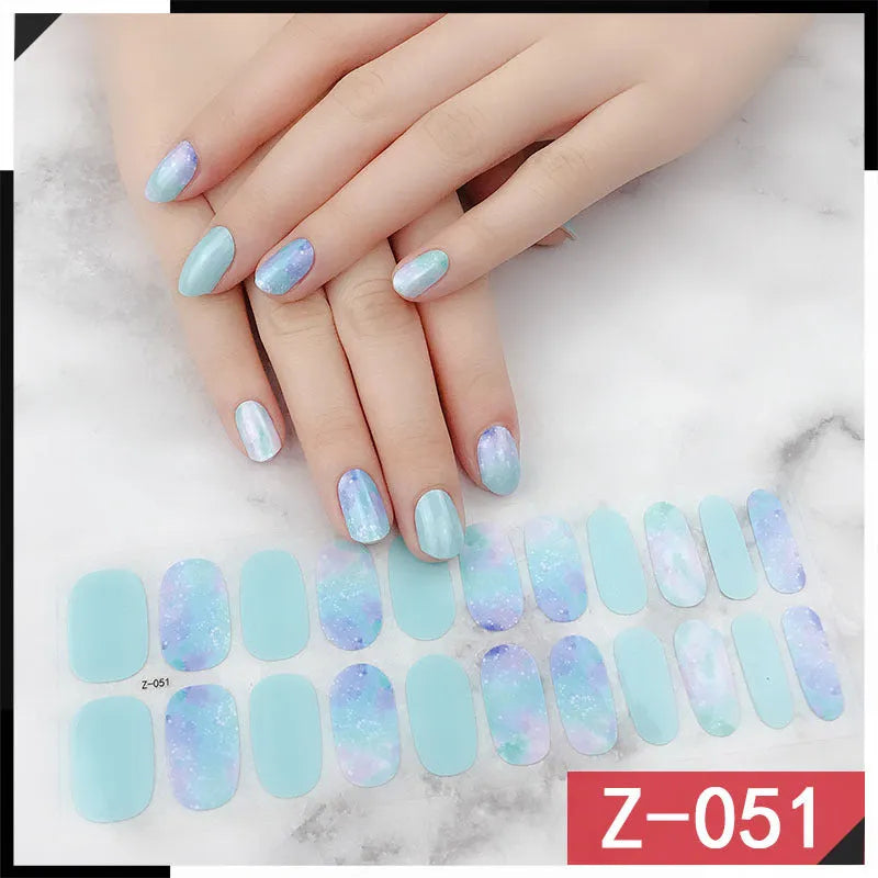 Korean Exquisite Nail Stickers pack showing colourful cartoon, floral, and embellished designs with included nail file.