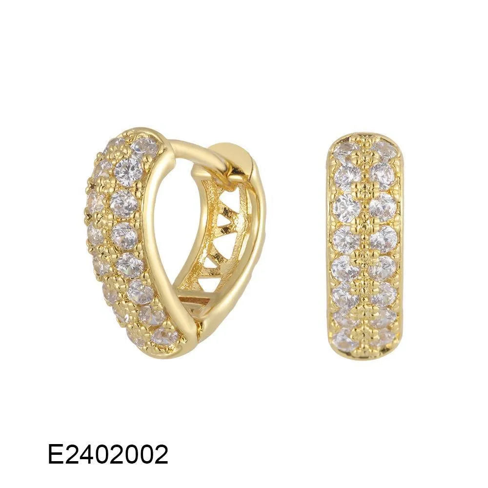 Gold plated heart shaped ear clip earrings with cubic zirconia stones on copper base