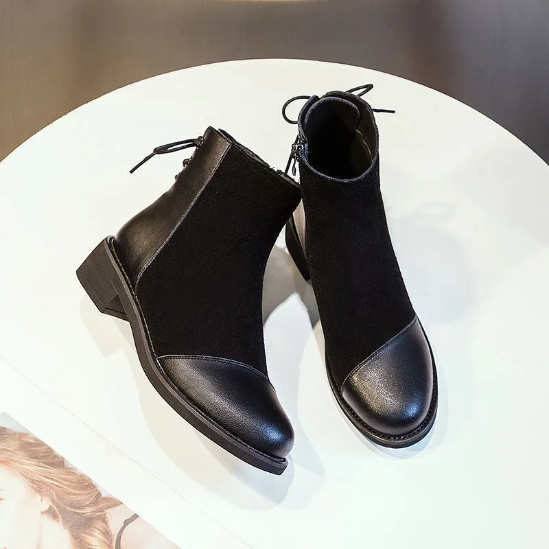 Women's black knee-high soft leather martin boots with side zipper and bow detail