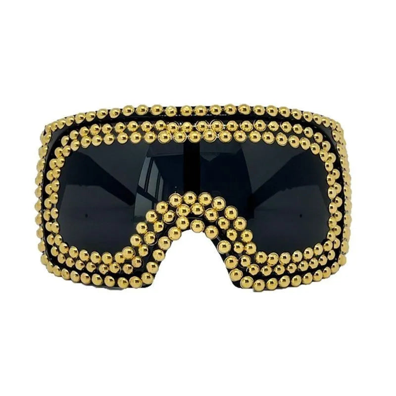Men's punk sunglasses with large rim and square rivet details in gold colour