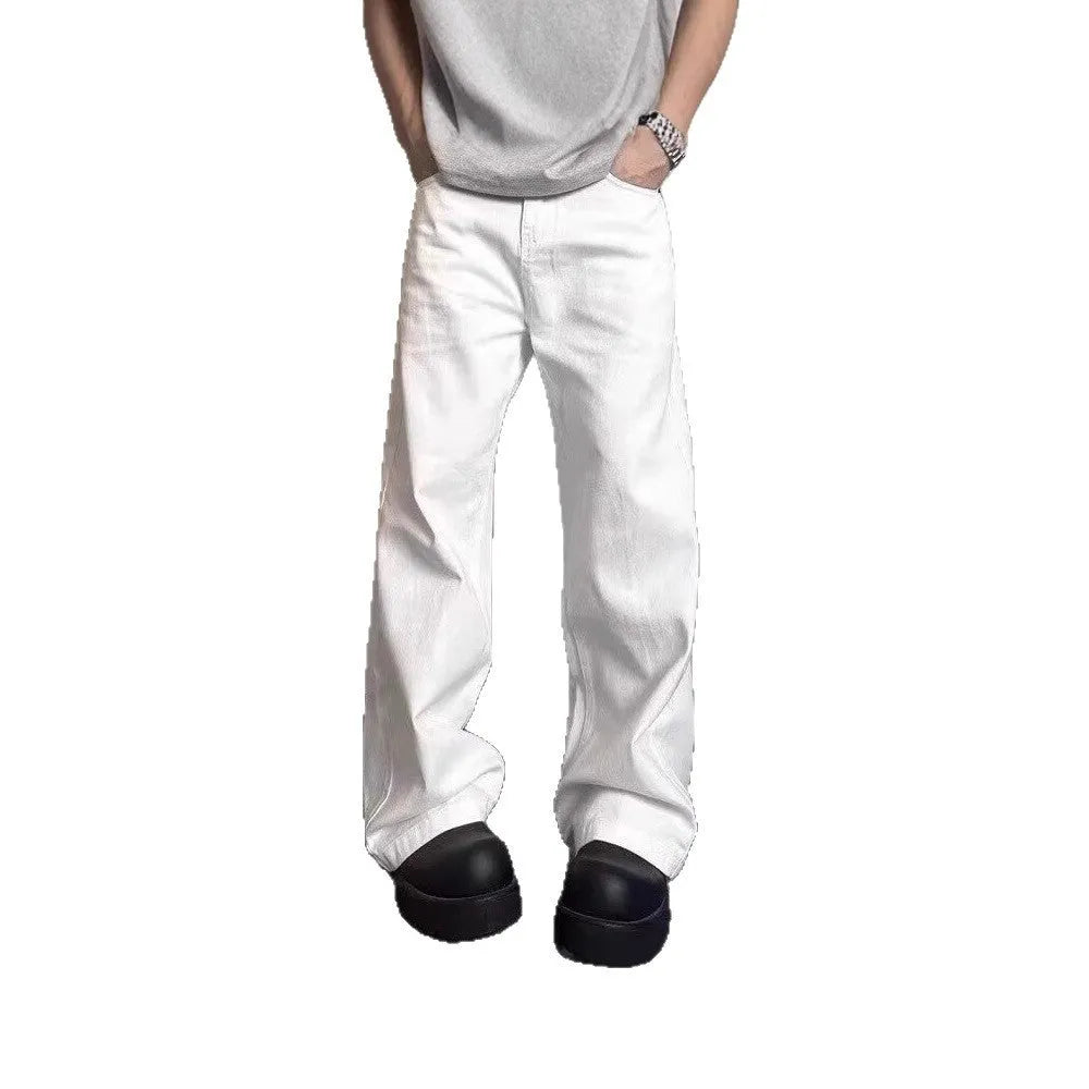 Men's white straight-leg wide-leg cotton denim jeans on a plain background.