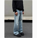 Men's blue straight leg jeans with whisker wash detail and wide leg flare