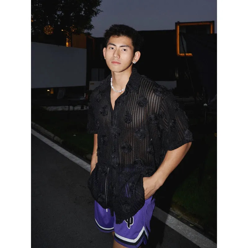 Man's loose fit short sleeve shirt with a heavy industry floral print in black.