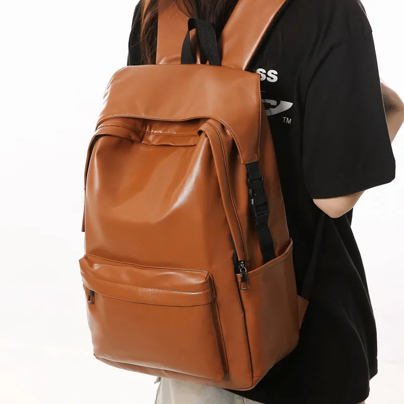 Travel Out large capacity PU leather backpack in black with air pillow belt and sewing thread design, 33x16x46cm