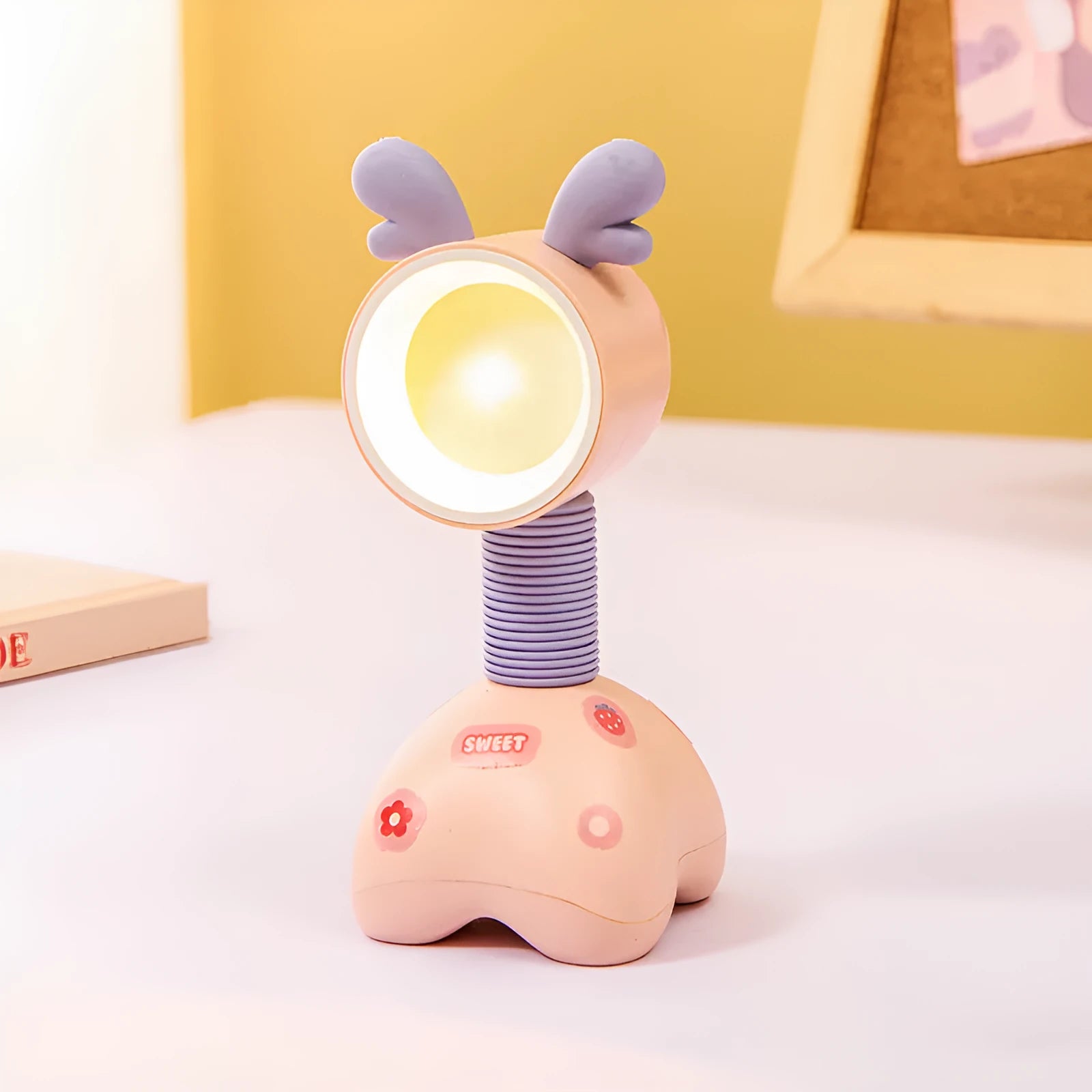 Cartoon animal magnetic night lamp with adjustable head on metallic surface