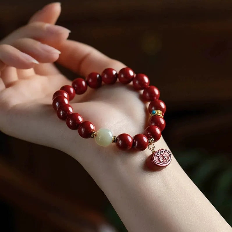 Natural cinnabar bracelet with Emperor sandstone Ping An Fu Lu design showing 8mm and 10mm bead size options.