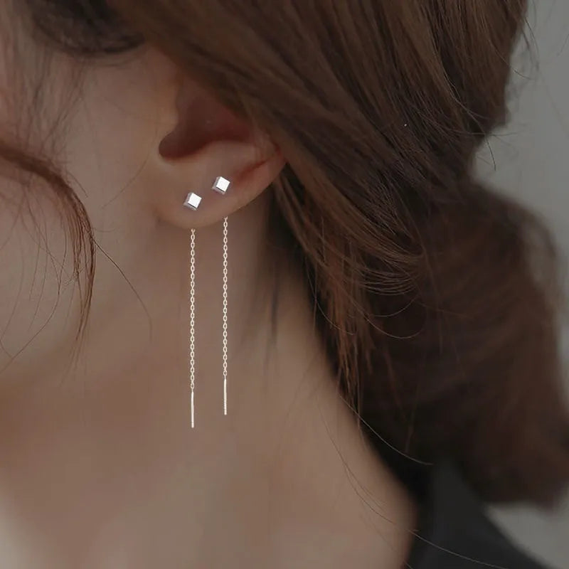 Long sterling silver needle ear string with a choice of geometric or pearl pendants for women.