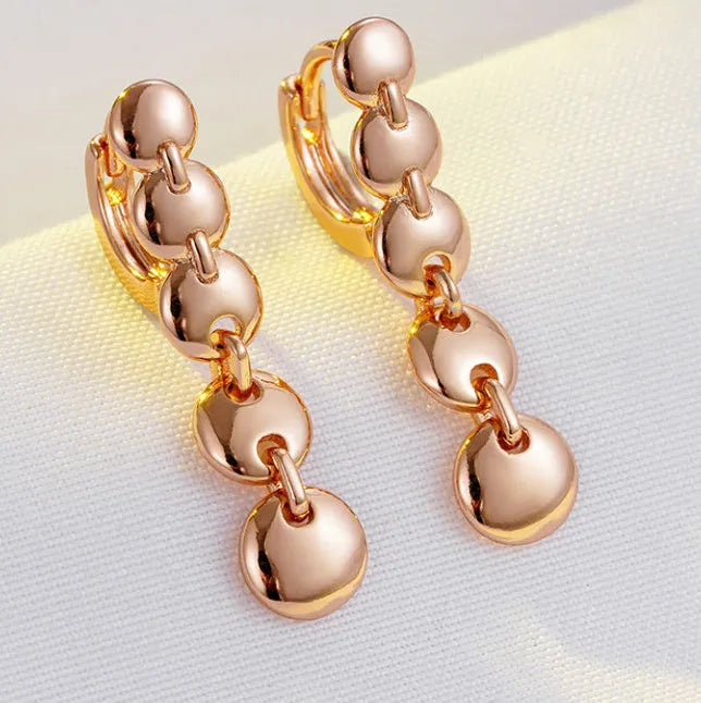 Retro gold-coloured long round circle earrings with woven copper texture and drop dangle design
