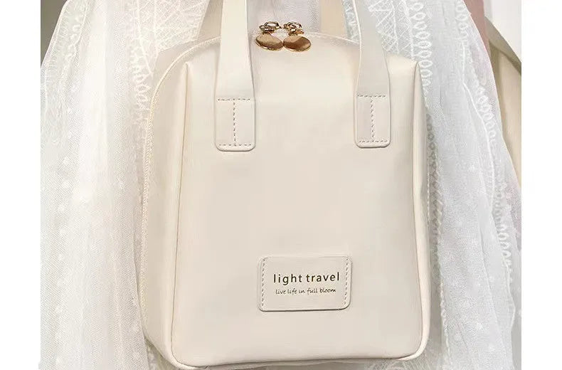 Shell shape PU leather waterproof cosmetic bag in milk apricot white with metal zipper