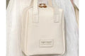 Shell shape PU leather waterproof cosmetic bag in milk apricot white with metal zipper