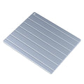 Aluminium household quick defrosting plate on a kitchen countertop