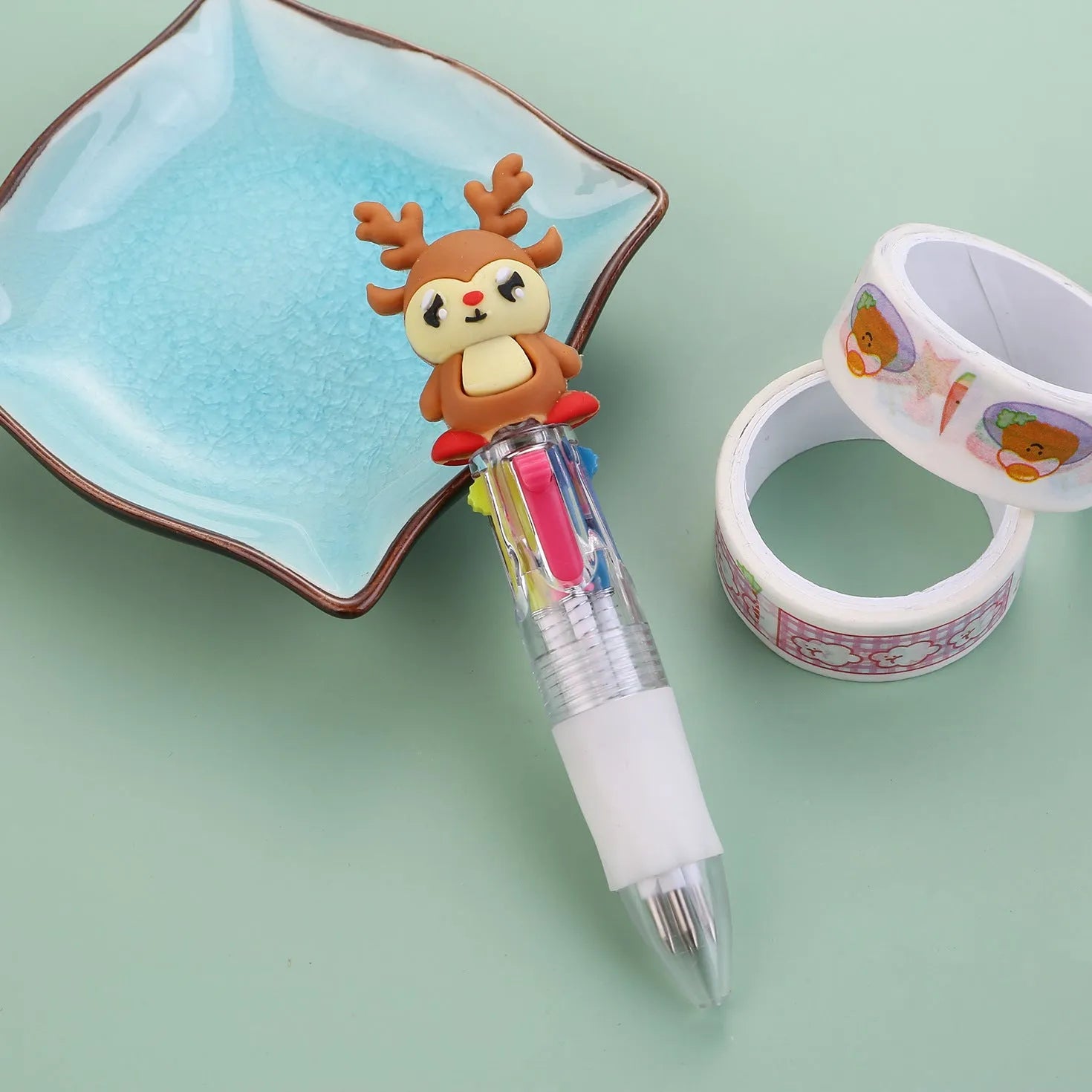 Compact 11cm Christmas-themed press-action ballpoint pen with festive designs.