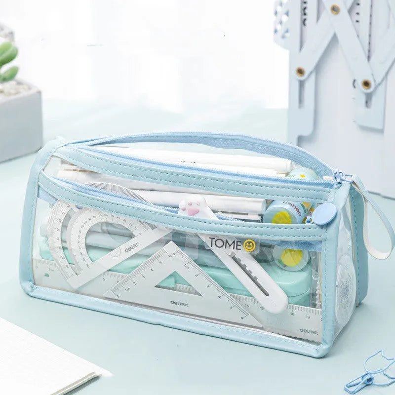 Large transparent double-layer pencil case in blue showing internal compartments, dimensions 220x110x80mm.