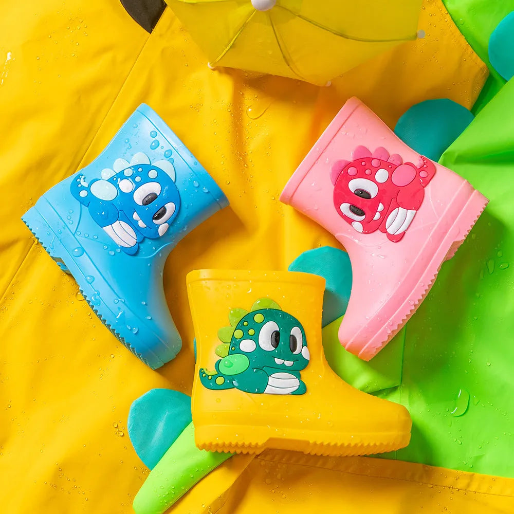 Children's cute waterproof PVC rain boots with cartoon dinosaur pattern in blue, pink, and yellow