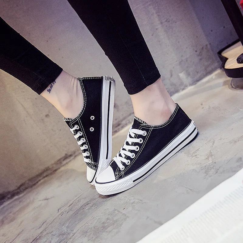 Women's casual canvas shoes in solid black, white-black, or white-red colour options