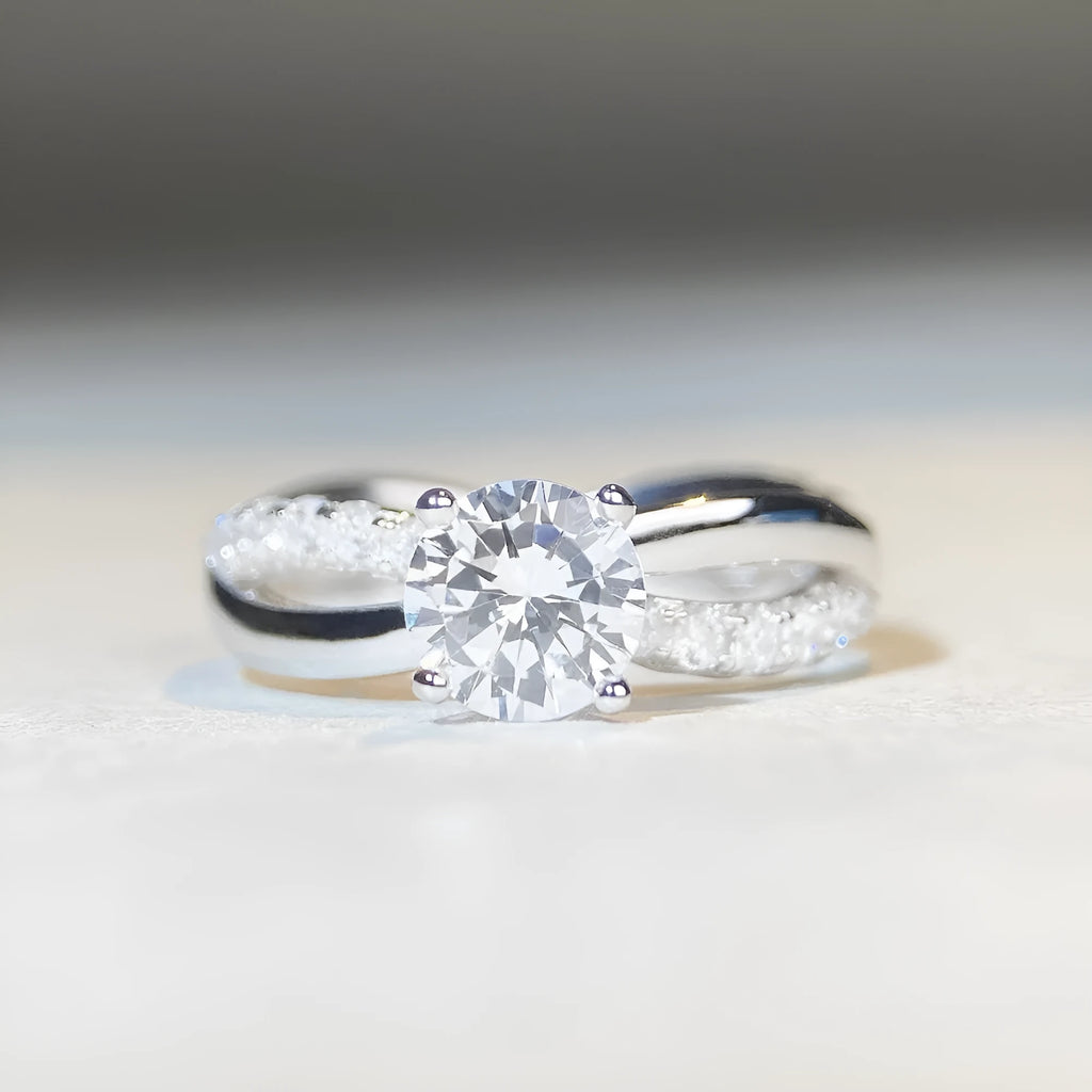 Silver geometric cross ring with 1 karat moissanite centre stone and twisted arm band