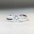 Silver geometric cross ring with 1 karat moissanite centre stone and twisted arm band