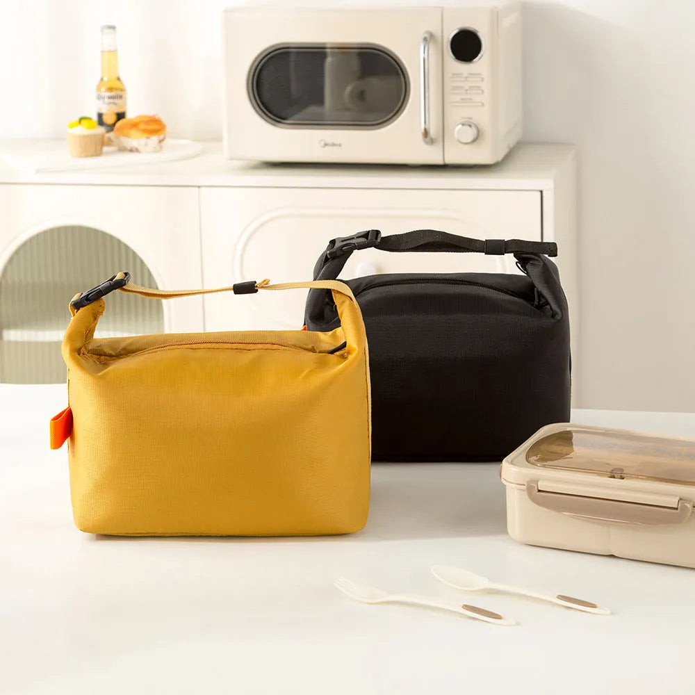 Japanese style thermal insulated lunch bag in Oxford cloth, grey colour, showing wide opening.
