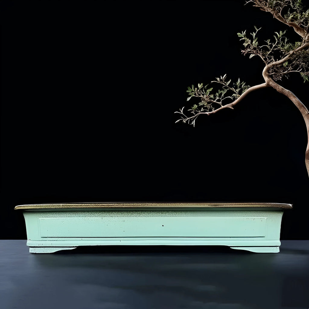Green retro ceramic bonsai flower pot with handmade purple sand crackle glaze.