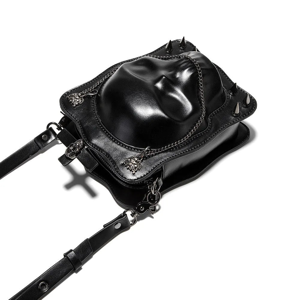 Black mini square crossbody bag with skull embroidery, decorative stitching, and metal chain details