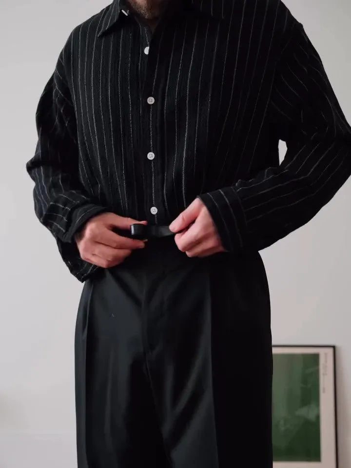 Black pinstripe button-down long-sleeve shirt laid flat, showing regular fit and striped pattern.