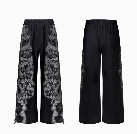 Streetwear set showing trousers, hoodie, and shorts in printed polyester fabric with loose fit design