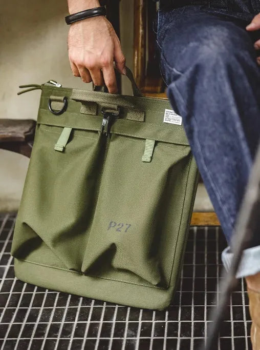 Marden Tooling medium canvas messenger bag in charcoal black with a shoulder strap and hard handle.