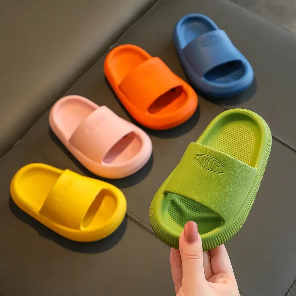 Children's bright coloured EVA slippers with non-slip soles in blue, green, orange, pink, and yellow.