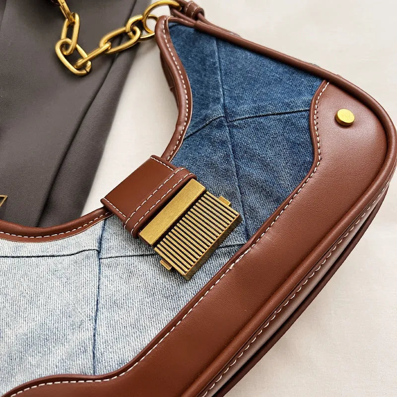 Women's brown denim shoulder bag with diamond chain accents and bucket shape design