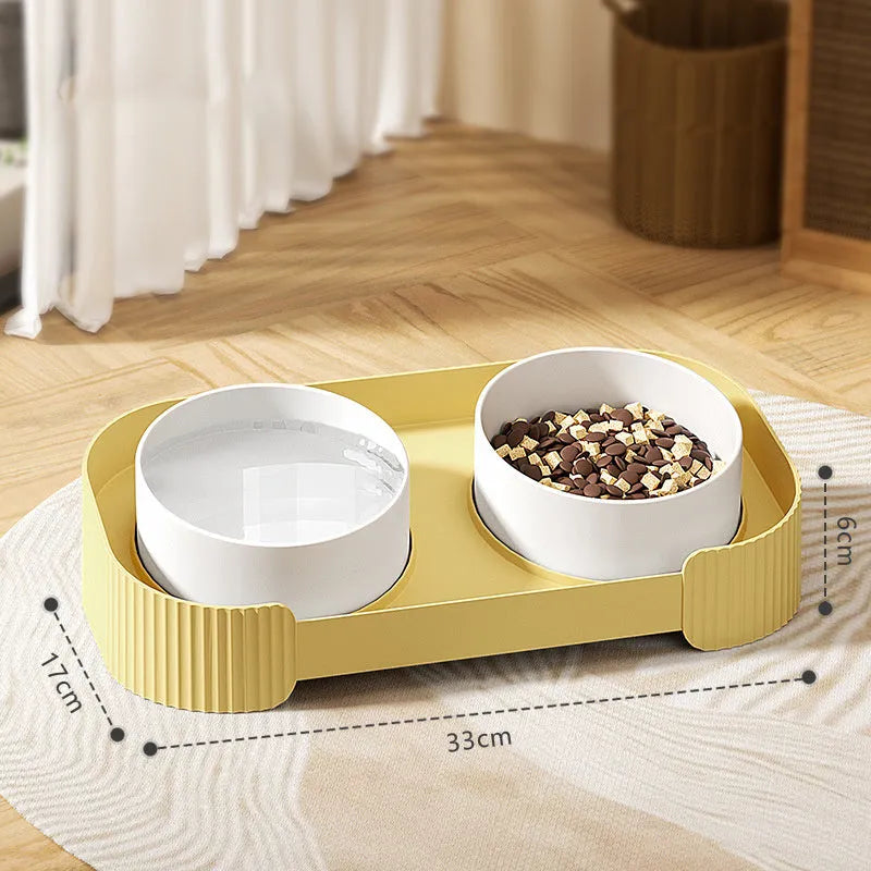 Green ceramic raised cat bowls on a tilted stand for anti-vomiting feeding