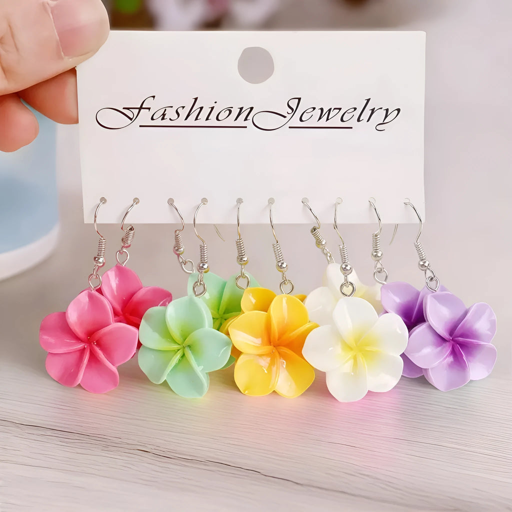 Handmade plastic resin earrings shaped like plumeria rubra flowers in a pair with multiple colour options